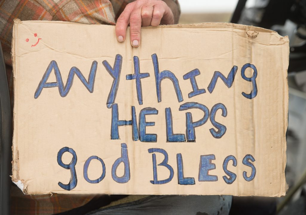 A panhandlers sign at the Pensacola Bay Bridge in Pensacola, Fl., Monday, March 9, 2015. (Michael Spooneybarger/ Pensacola Today)